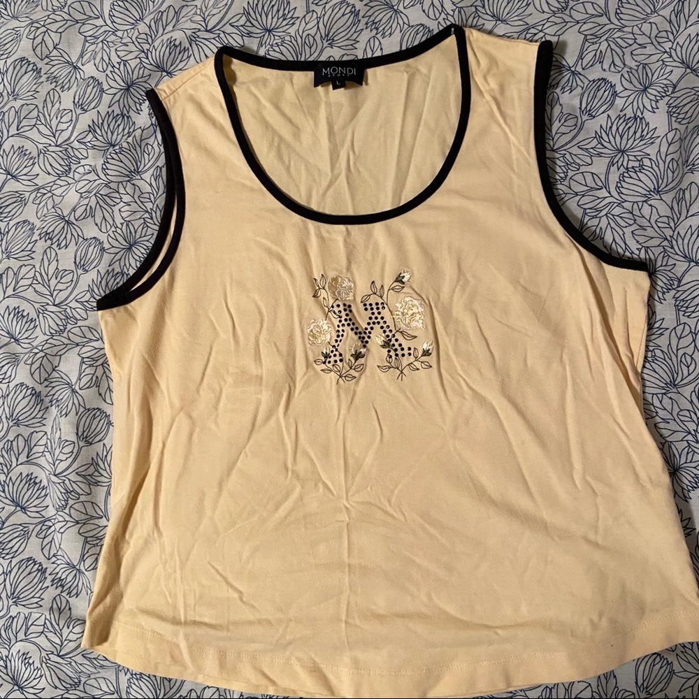 Mondi tank with letter M on it